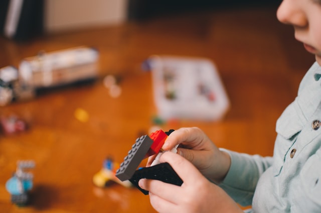 boy playing with Legos